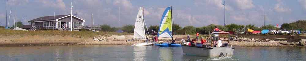 Langstone Sailability boats in front of the the Langstone Sailing Club slipway and Clubhouse